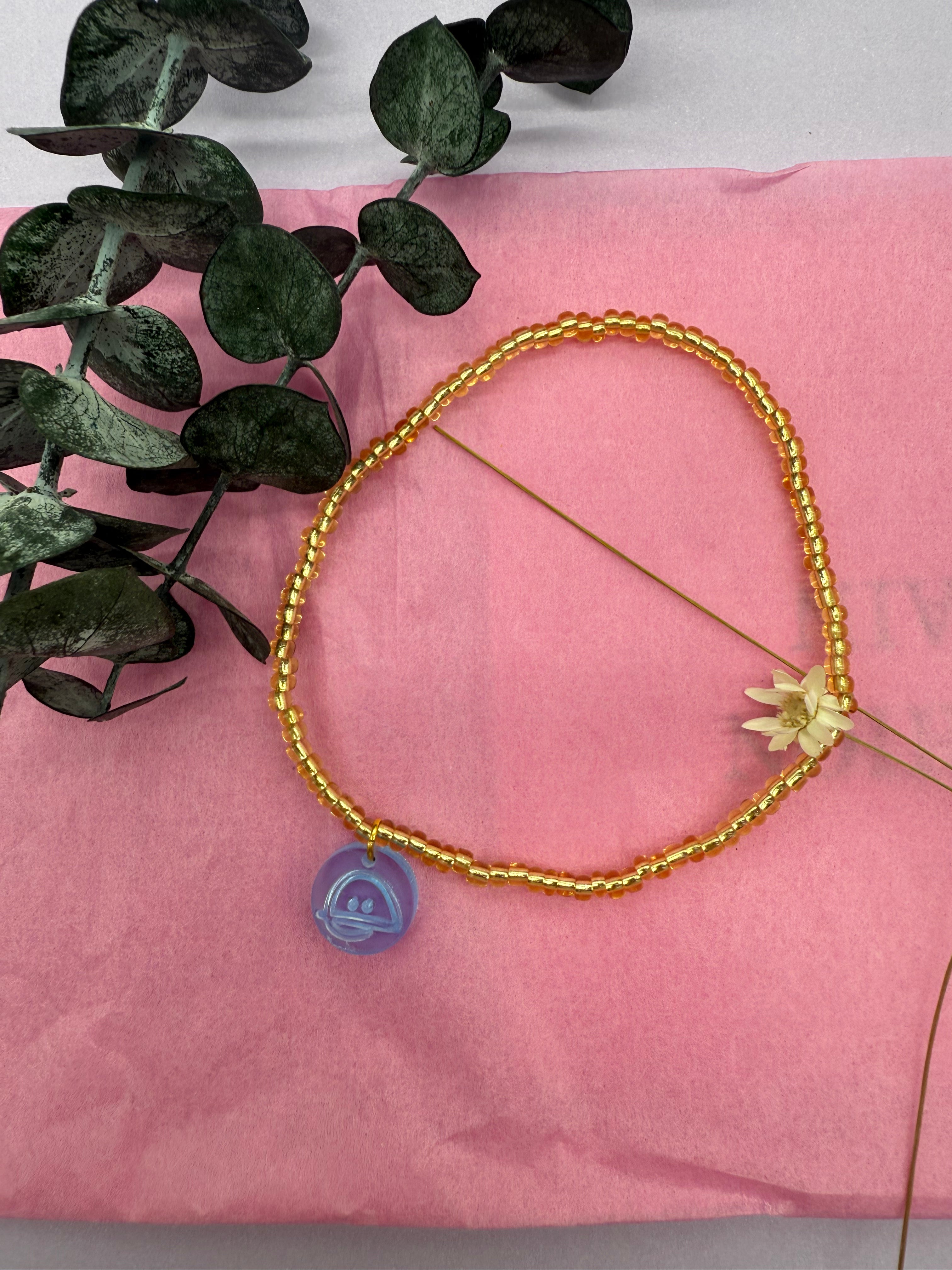 Fußbändchen mit Neon-BAIZO-Smileyanhänger